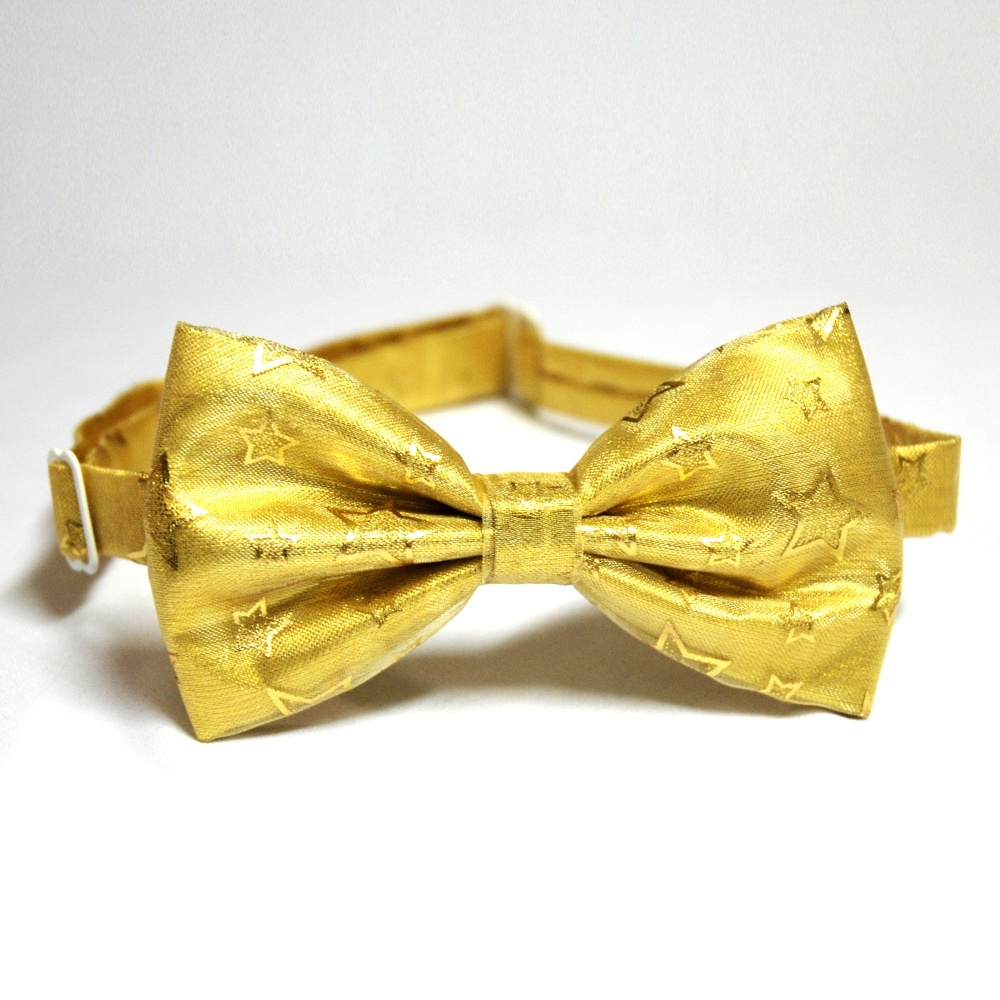 Zlatý motýlek s hvězdami