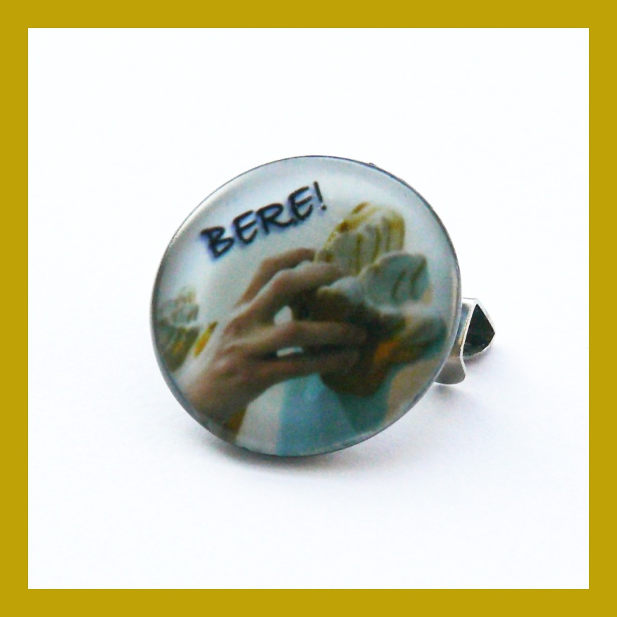 Odznáček s lezeckým chytem