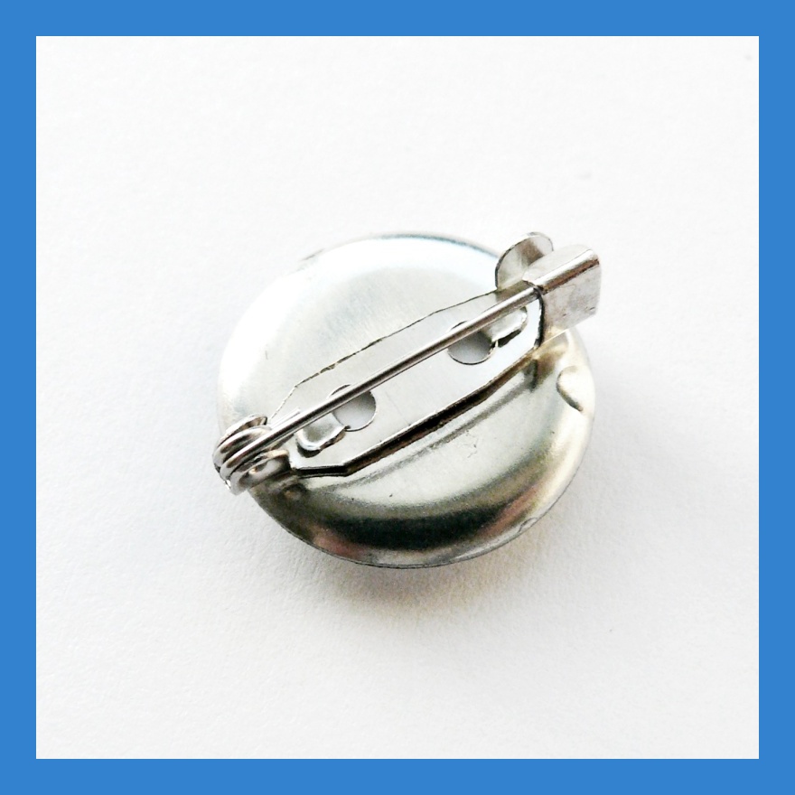 Odznáček s horolezcem