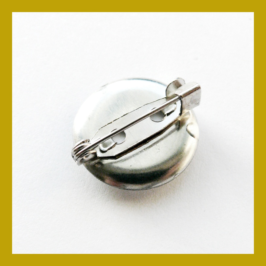 Odznáček s lezeckým chytem